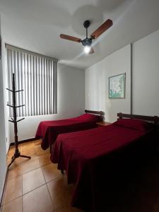 Ένα ή περισσότερα κρεβάτια σε δωμάτιο στο Apartamento Guarapari Praia Castanheiras +14 φωτογραφίες