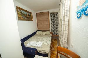 Postel nebo postele na pokoji v ubytování Apartmani Odmor i Mir