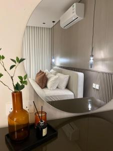 a room with a bed and a sink and a mirror at 101 - Comfy Space - 80TV smart - Self Check-in in Riyadh