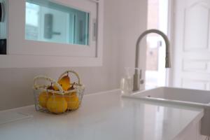 a basket of fruit sitting on a counter in a kitchen at Red letter day #Dongdaemun #Seongsu #Hanyangdae #Ttukseom #SubwayStreet 5 minutes #netflix #emotional #legalhome in Seoul