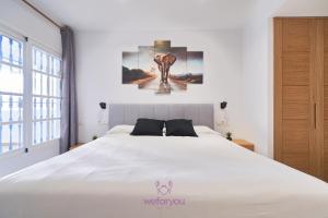 Posteľ alebo postele v izbe v ubytovaní weforyou Isla de Poniente 2 Bedrooms and Parking