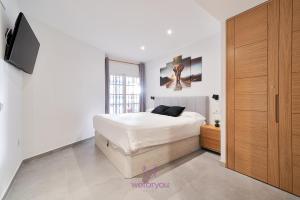 Posteľ alebo postele v izbe v ubytovaní weforyou Isla de Poniente 2 Bedrooms and Parking