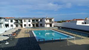 a swimming pool on top of a building at Casa Matteo-Modern Apartment with Pool in Costa de Antigua