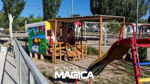 a playground with a slide in a park at Cabañas La Sagrada Familia in El Nihuil