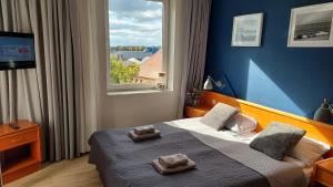Postel nebo postele na pokoji v ubytování Apartament Sympatia Kołobrzeg Etna Polonia 718