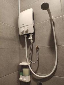 a shower head on a wall in a bathroom at Heritage House 2BR in Town walkto UNESCO Site & StreetArt 45 in George Town