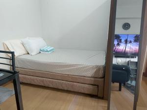 Voodi või voodid majutusasutuse Happy Stays A - Sunset View at SMDC Hope Residences toas