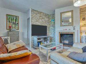 Et tv og/eller underholdning på Holiday Home Eden Parc by Interhome