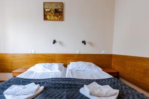 Postel nebo postele na pokoji v ubytování Hotel Dom Marynarza