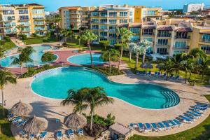 an aerial view of a swimming pool at a resort at Beachfront - Best Beach View Studio - E422-1 in Palm-Eagle Beach
