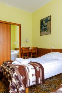 Postel nebo postele na pokoji v ubytování Hotel Dom Marynarza