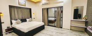 Postel nebo postele na pokoji v ubytování Hotel Sahara Residency + 25 fotografií