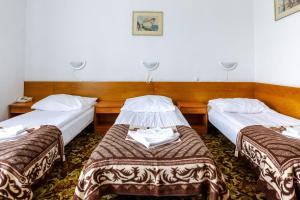 Postel nebo postele na pokoji v ubytování Hotel Dom Marynarza