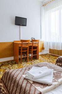 Postel nebo postele na pokoji v ubytování Hotel Dom Marynarza