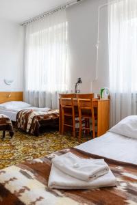 Postel nebo postele na pokoji v ubytování Hotel Dom Marynarza