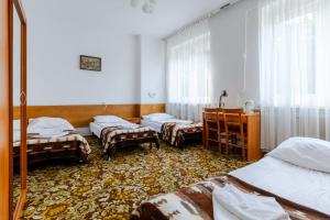 Postel nebo postele na pokoji v ubytování Hotel Dom Marynarza