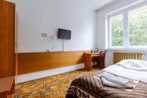 Postel nebo postele na pokoji v ubytování Hotel Dom Marynarza