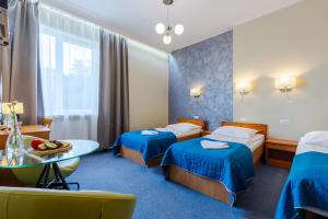 Postel nebo postele na pokoji v ubytování Hotel Dom Marynarza