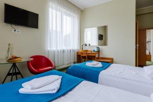 Postel nebo postele na pokoji v ubytování Hotel Dom Marynarza