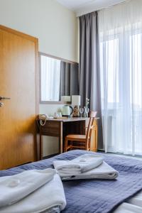 Postel nebo postele na pokoji v ubytování Hotel Dom Marynarza