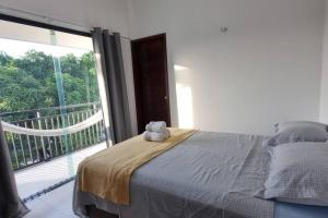 Ένα ή περισσότερα κρεβάτια σε δωμάτιο στο Casa Xodozinho +28 φωτογραφίες