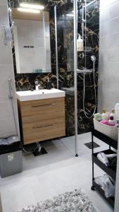 a bathroom with a sink and a shower at Apartment Kivistö, 2 km from centrum, free wifi and parking, no smoking, non-allergenic in Jyväskylä +44 photos