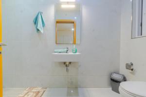 a white bathroom with a mirror and a sink at New Spacious Apartment 3 Bdr 2 Bth Bugibba 124 with View in St. Paul's Bay +16 photos