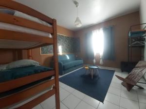 Postel nebo postele na pokoji v ubytování Ti'Kratèr Chambres d'hôtes