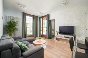 TV a/nebo společenská místnost v ubytování GO Apartments - ApartHotel