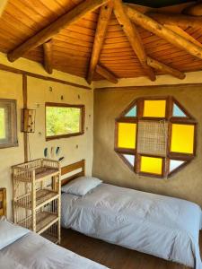 Postelja oz. postelje v sobi nastanitve Swiss Eco Lodge La Linda Loma - Olmué