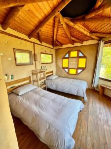 Voodi või voodid majutusasutuse Swiss Eco Lodge La Linda Loma - Olmué toas