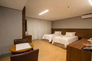 Postel nebo postele na pokoji v ubytování Hotel Gran Odara