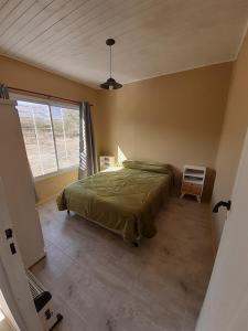 Postel nebo postele na pokoji v ubytování El Alto