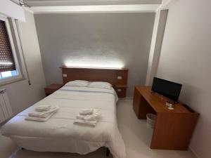 Postel nebo postele na pokoji v ubytování Hotel Ristorante StellAmiata