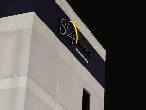 a scientology sign on the side of a building at Sleep Inn & Suites Memphis Southeast in Memphis