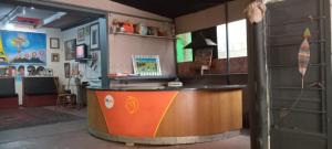 a bar in a room with a door open at Paljas Backpackers in Potchefstroom