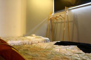 a bedroom with a bed and a projection screen at Casa Tia Etelvina in Castro Daire