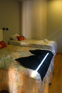 two beds in a room with at Casa Tia Etelvina in Castro Daire