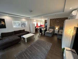 Posezení v ubytování Malibu Apartman Jakuzzi