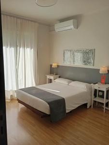 a bedroom with a large bed and a window at Hostal El Ninot in Barcelona +30 photos