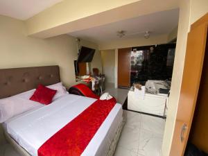 Gulta vai gultas numurā naktsmītnē Hotel SPRING