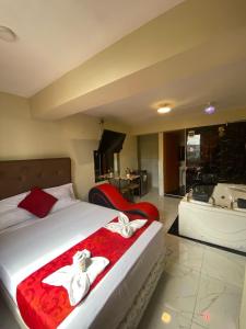 Gulta vai gultas numurā naktsmītnē Hotel SPRING