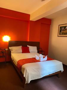 Gulta vai gultas numurā naktsmītnē Hotel SPRING