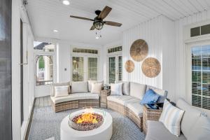 a living room with a couch and a fire pit at Amazing House - Movie & Game Room, Hot Tub, Fire Pit & Golf Course in Luray