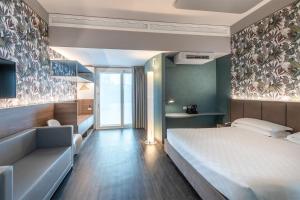 Posteľ alebo postele v izbe v ubytovaní MO.OM Hotel + 37 fotografií