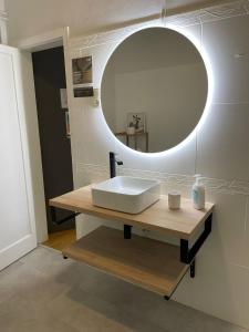 a bathroom with a sink and a mirror at Hostal El Ninot in Barcelona
