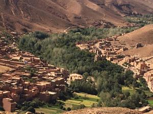 an aerial view of a village in the mountains at Hôtel panoramique de la vallée in Aït Idaïr
