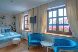 Ένα ή περισσότερα κρεβάτια σε δωμάτιο στο Motlawa Apartments Gdansk Old Town
