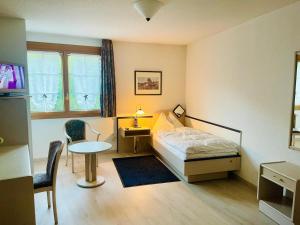 Ένα ή περισσότερα κρεβάτια σε δωμάτιο στο Le Cavalier