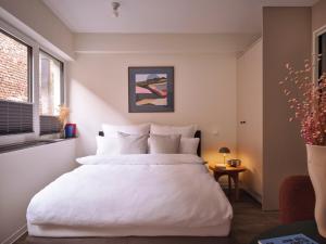 Postel nebo postele na pokoji v ubytování STAYERY Cologne Sülz